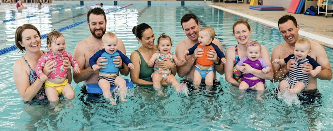 Parents and babies enjoying swim lessons at Marlin Coast Swim School